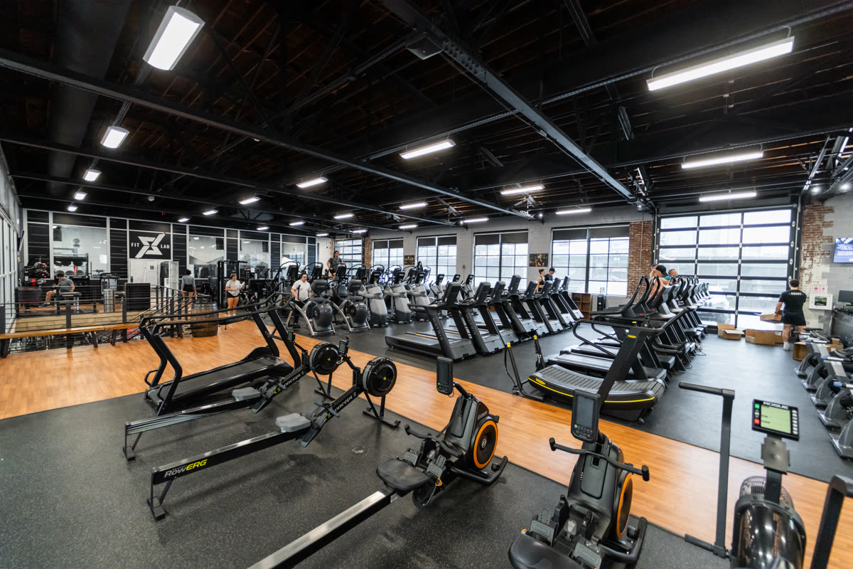 Long row of treadmills at QNTM Fit Life